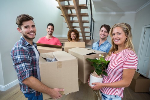 Careful loading of furniture into a moving van in Bow