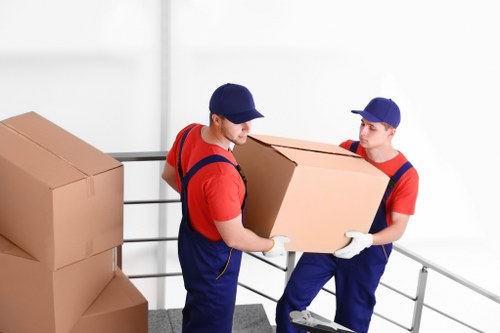 Removal van and moving boxes prepared for a flat move in Bow