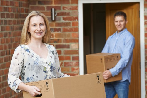 Trained movers handling boxes and furniture with care