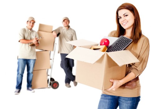 Removal van outside a Bow home with movers handling household items