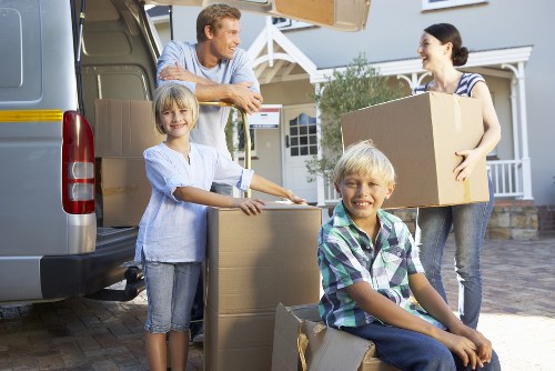 Man and van service carrying boxes for a Bow home or office move