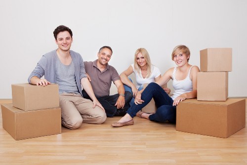 Packed household boxes and furniture prepared for removals in Bow